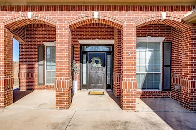Entrance to property with brick siding