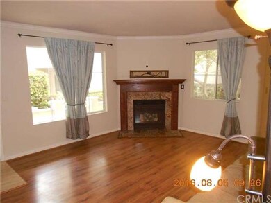 Large living room with gas fireplace.  Both window