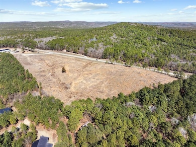 Birds eye view of property featuring a view of tre