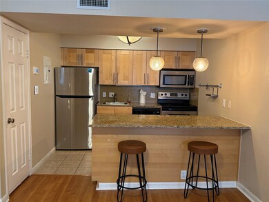 Kitchen featuring appliances with stainless steel