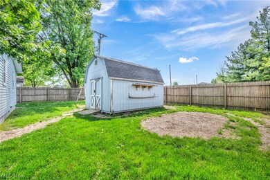 View of yard with a storage shed