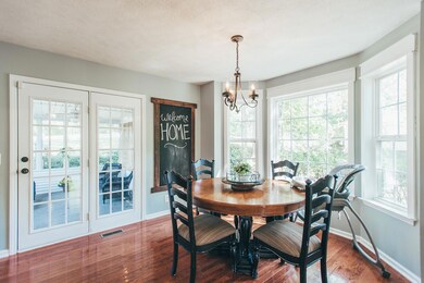 Beautiful bay window overlooks partially wooded side yard!