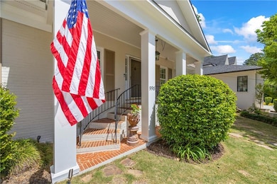 Doorway to property featuring covered porch