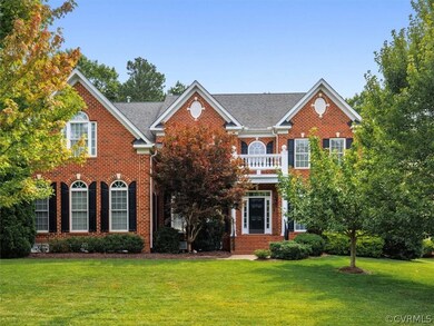 Gorgeous brick front with exquisitely landscaped f