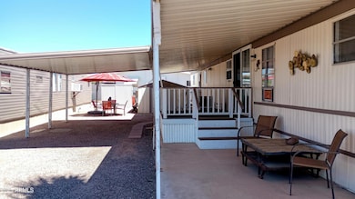 Front- covered patio and Carport