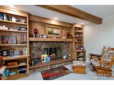 Native stone wood burning fireplace with built ins