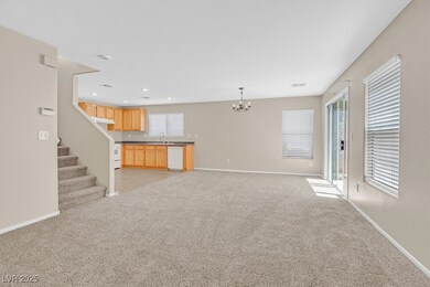 Unfurnished living room with a chandelier, a sink,