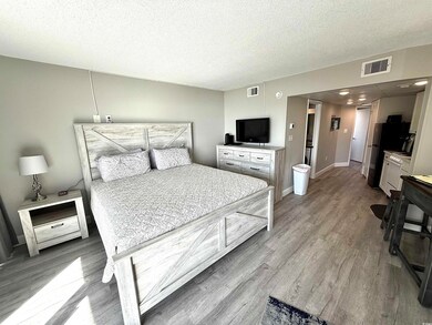 Bedroom featuring wood-type flooring and a texture