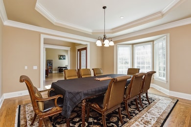 Formal dining with trey ceilings and beautiful hardwood flooring
