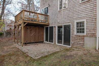 OUTDOOR SHOWER AND DECK IN REAR OF HOME