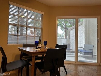 Dining area opens to patio. Slider doors with blin