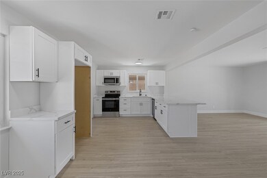 Kitchen with appliances with stainless steel finis