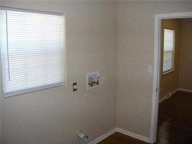 Laundry room just off the kitchen and the half bat