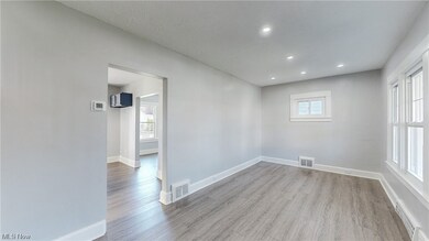 Living room with plenty of natural light and light wood-type flooring