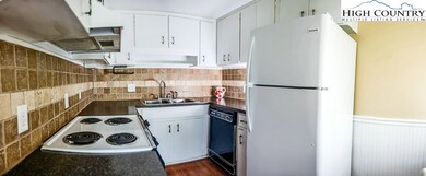 A fuller view of the kitchen.  Catch a tiny glimps