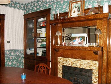 Dining Room. ~Cozy Fireplace and Built-In Hutch in