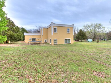 Back of house with a yard and a wooden deck