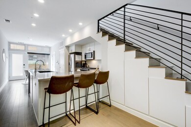 Kitchen featuring light wood-style flooring, a si