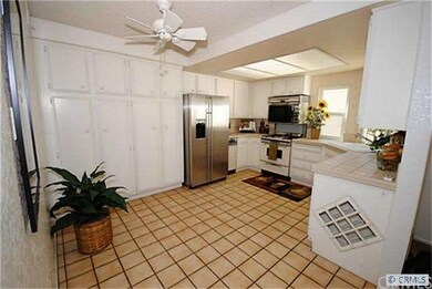 Spacious kitchen features floor to ceiling cabinet