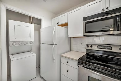 Kitchen featuring stainless steel appliances, sta