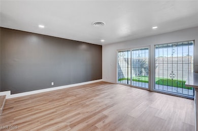 Empty room with baseboards, recessed lighting, vis