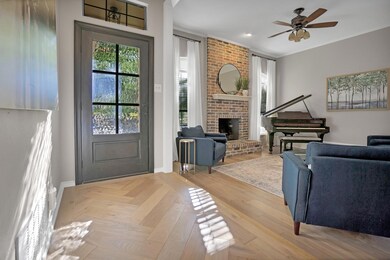 As you enter through the front door, the European white oak herringbone entryway beckons you forward.