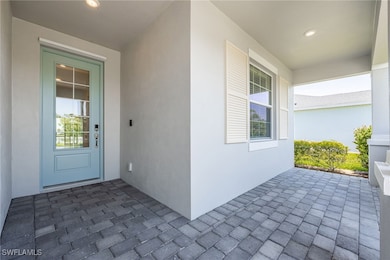 Property entrance with stucco siding