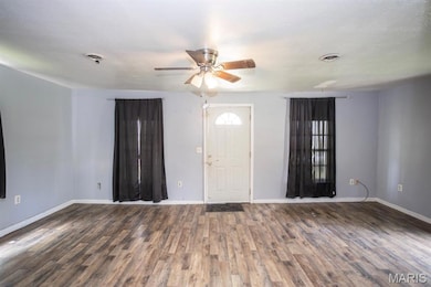 Entryway featuring wood finished floors and a ceiling fan