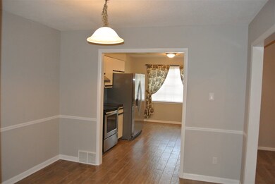 Formal dining room with new flooring and chair rai