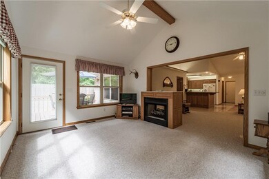 Sunroom has lots of morning light and the 2sided fireplace is a bonus.