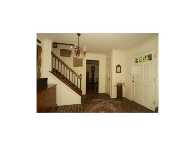Large entrance with brick floor.