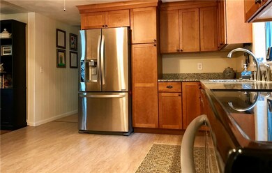 Kitchen floor plan flows into living room space