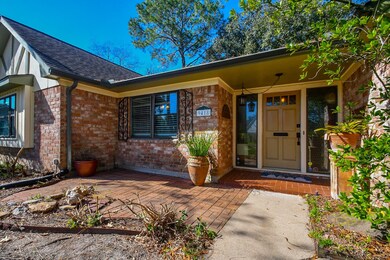 Inviting entry with stone patio.