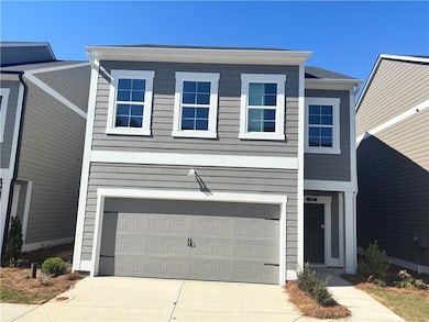 View of front of property featuring a garage