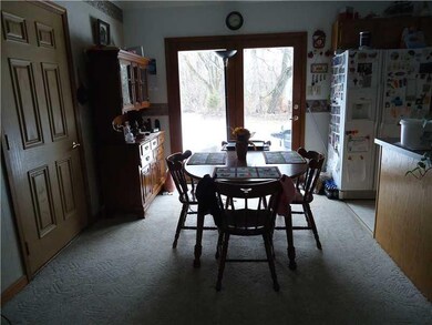 Exterior Front. Dining Room and View of outdoors through Double Doors
