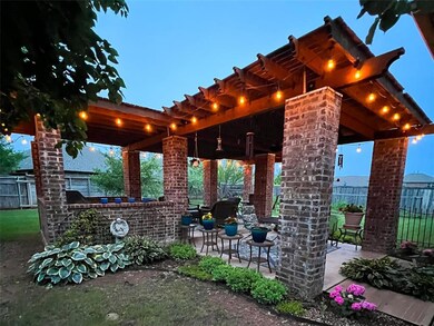 Fenced backyard with a patio area