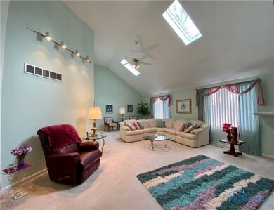Great room with vaulted ceiling & skylight.