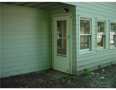 Exterior Back. back entrance to enclosed porch