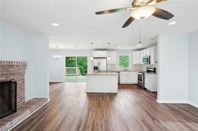 Kitchen with appliances with stainless steel finis
