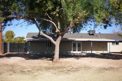 RV gate and back of house with a new roo