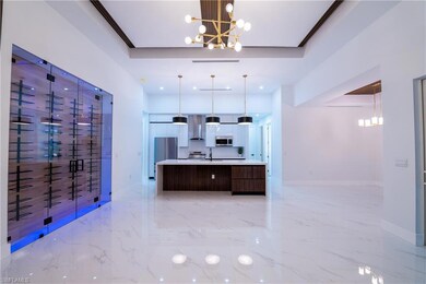 Kitchen featuring a large island, decorative light