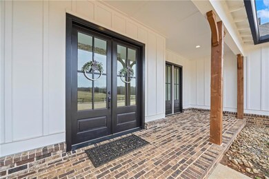 Property entrance featuring french doors