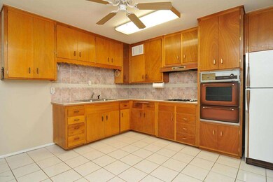 Kitchen w/ tile countertops & backsplash