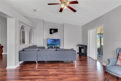 Family room with slider to screened lanai.