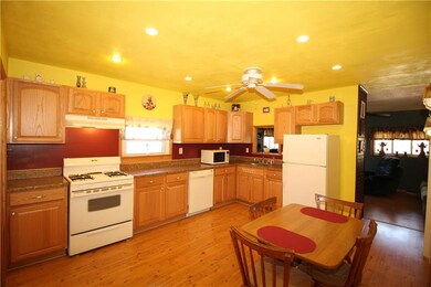 Spacious Eat-in Kitchen w/ Plenty of Wood Cabinets