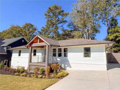Ranch-style house featuring covered porch and a fr