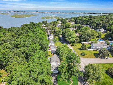 Aerial perspective of suburban area with a large body of water