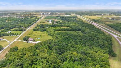 The property spans from 95th St shown on the left to K10 highway on the right.  This view is looking west showing the water tower on 95th St.