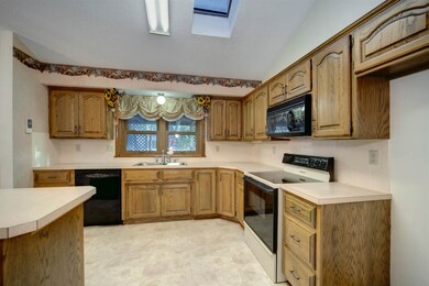 Features cabinets & lots of custom pantry storage.