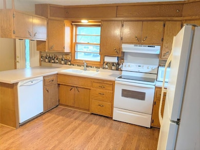 Newer appliances. New kitchen faucet. Counter micr